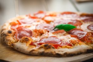 Fresh pizza on a cutting board