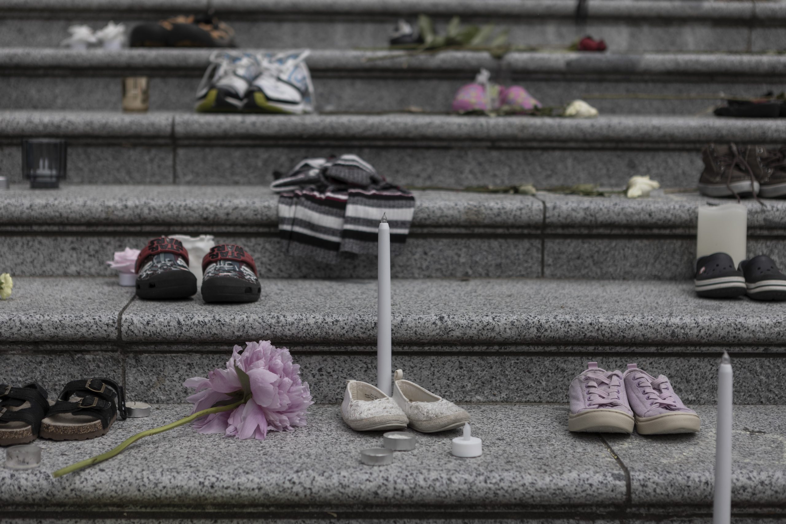 memorial of numerous children's shoes representing the 215 215 children whose remains were found in a residential school